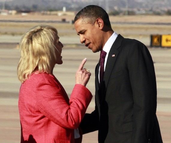 FILE - In this Jan. 25, 2012, file photo, Arizona Gov. Jan Brewer points during an intense conversation with President Barack Obama after he arrived at Phoenix-Mesa Gateway Airport, in Mesa, Ariz. In the summer of 2010, race and politics collided when Arizona Republicans passed an immigration law that critics said would lead to racial profiling of Hispanics. Jose Lozano, vice president of the Massachusetts Association of Minority Law Enforcement Officers, remembers Brewer wagging her finger in the president's face, which he thought was ugly and hadn't seen before. "There's no way that would have ever happened to a white president," Lozano said. (AP Photo/Haraz N. Ghanbari, File)